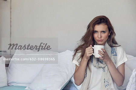 Woman enjoying cup of coffee