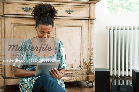 Woman reading e-book on digital tablet