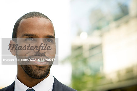 Businessman smiling, portrait