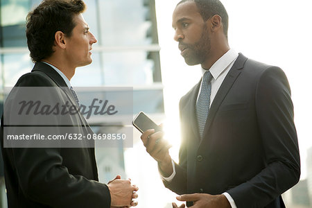 Businessmen talking outdoors