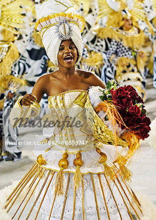 Brazil, State of Rio de Janeiro, City of Rio de Janeiro, Samba Dancer in the Carnival Parade at The Sambadrome Marques de Sapucai.