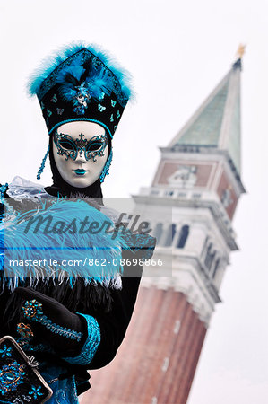 Venice Carnival mask with the St. Mark bell tower. Venice, Veneto, Italy, Europe