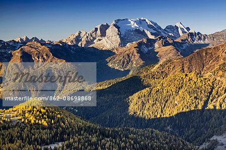 Europe, Italy, Veneto, Belluno. The grassy ridge of Padon, behind it the Marmolada, Dolomites