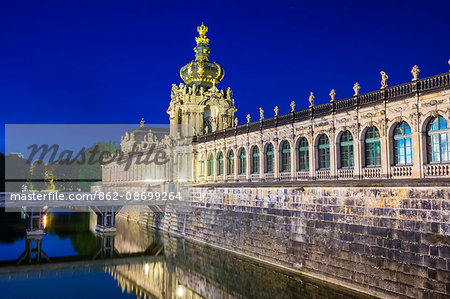 Germany, Saxony, Dresden, Altstadt (Old Town). Zwinger Palace at night, built in Rococo style and designed by court architect Matthäus Daniel Pöppelmann.