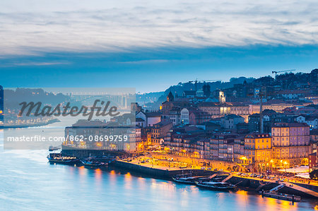 Portugal, Douro Litoral, Porto. Dusk in the UNESCO listed Ribeira district of Porto.