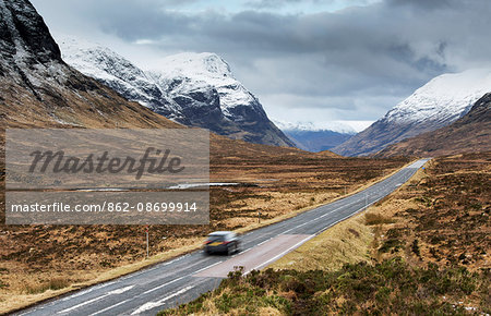 Scotland, Glencoe. The A82 road passing snow capped mountains in winter.