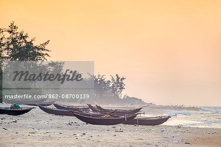 Traditional bamboo basket fishing boats on the beach at sunset, Thuan An Beach, Phu Vang District, Thua Thien-Hue Province, Vietnam