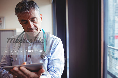 Doctor using digital tablet in the hospital