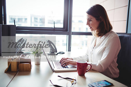 Woman working on laptop in the office