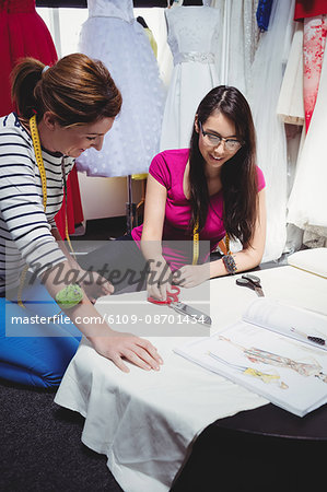 Female fashion designer working together in the studio