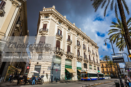 Ornate architecture along Via Roma in the shopping district of historic city of Palermo in Sicily, Italy