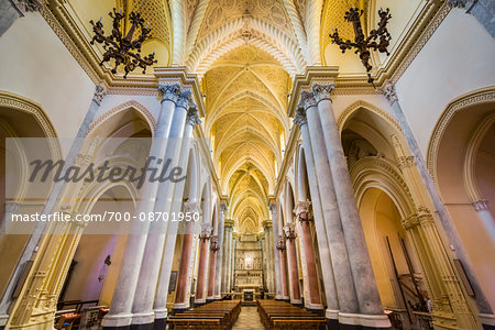 Architectural interior showing the main aisle lined with pilars in the elegant Royal Cathedral (Real Duomo) in historic Erice in Sicily, Italy