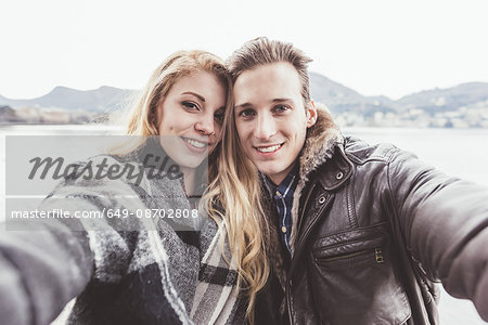 Portrait of young couple taking selfie, Lake Como, Italy