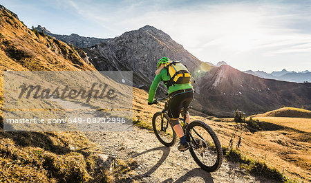 Cyclist on mountain biking area, Kleinwalsertal, trails below Walser Hammerspitze, Austria
