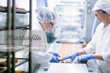 Factory workers on food production line