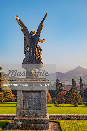 A winged sculpture overlooks the Italianate terraces of the Powerscourt Estate at sunset, Powerscourt Demesne, Enniskerry, Co. Wicklow, Ireland.