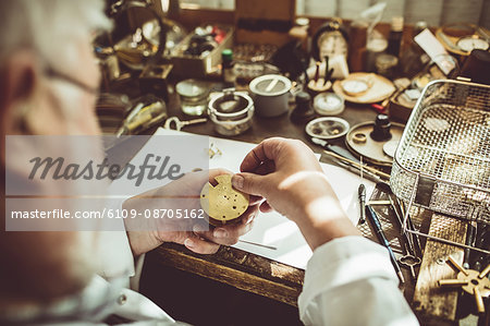 Horologist repairing a watch in the workshop