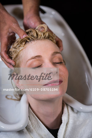 Woman getting her hair wash at a salon