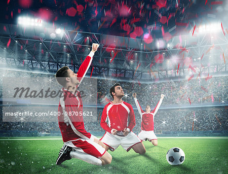 Soccer players exults on a stadium field