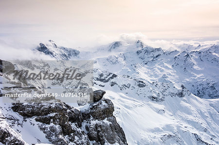 Snow covered landscape and low cloud, Mount Titlis, Switzerland