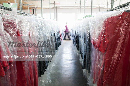 Diminishing perspective of garments on clothes rail in sewing factory