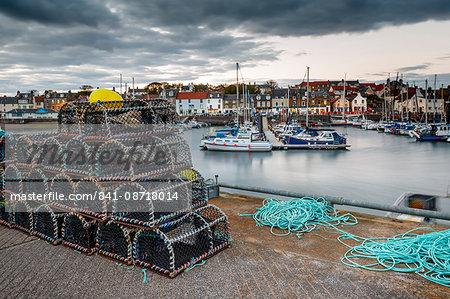 Sailing boats and crab pots at dusk in the harbour at Anstruther, Fife, East Neuk, Scotland, United Kingdom, Europe