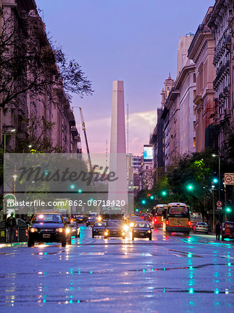 Argentina, Buenos Aires Province, City of Buenos Aires, Twilight view of Av Pres. Roque Saenz Penathe and Obelisco de Buenos Aires.