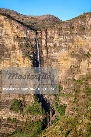 Ethiopia, Amhara Region, Simien Mountains.  A waterfall cascading down an escarpment on an eastern section of the rugged Simien Mountains which rise to 4550m above sea level.