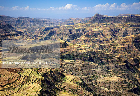 Ethiopia, Amhara Region, Simien Mountains.  The spectacular terrain in the foothills of the high-altitude Simien Mountains arises from the uplifting and erosion of lava from volcanic eruptions 20-30 million years ago.