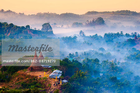 Mrauk-U, Rakhine state, Myanmar. Mrauk-U valley in a foggy sunrise seen from the Shwetaung pagoda.