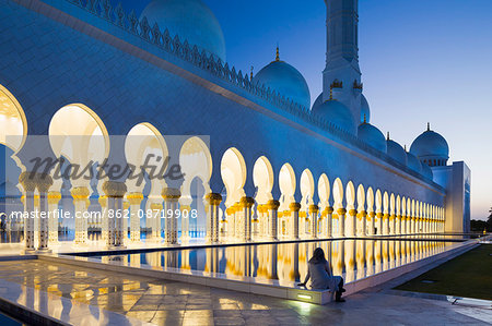United Arab Emirates, Abu Dhabi. The water pools of Sheikh Zayed Grand Mosque combined with the open colonnades help to provide a significant cooling airflow through to the main courtyard.