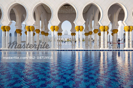 United Arab Emirates, Abu Dhabi. The water pools of Sheikh Zayed Grand Mosque combine with the open colonnades to provide a significant cooling airflow through to the main courtyard.