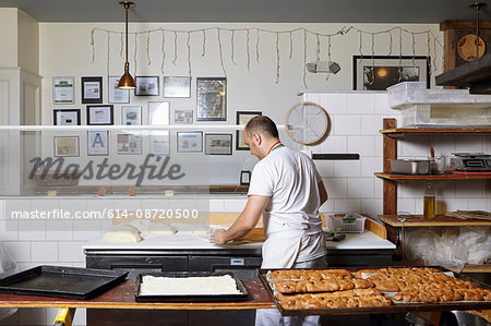 Baker working in bakery