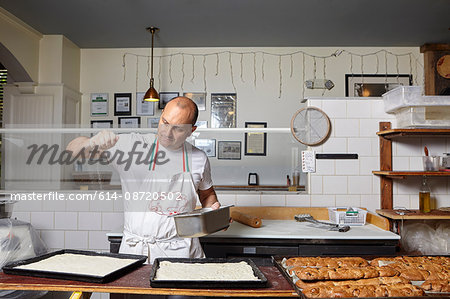 Baker working in bakery