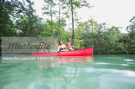 Family on a canoe trip together at Econfina Spring, Florida, USA