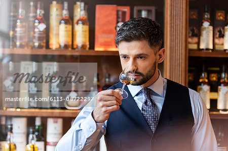 Well-dressed man whiskey tasting Well-dressed man whiskey tasting