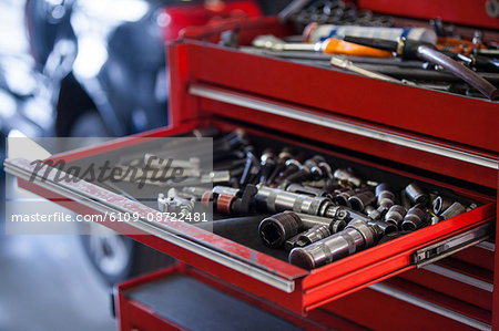 Set of work tools in toolbox at repair garage