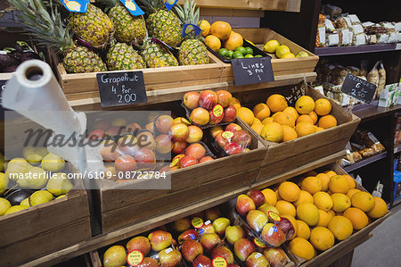 Variety of fruits in wooden box at supermarket