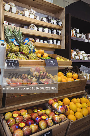 Variety of fruits in wooden box at supermarket