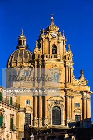 Rooftop and upper section of the Cathedral of Saint George (Duomo di San Giorgio) against a blue sky in Ragusa in Sicily, Italy Rooftop and upper section of the Cathedral of Saint George (Duomo di San Giorgio) against a blue sky in Ragusa in Sicily, Italy