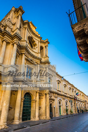 Street view of the Church of Montevergine (Chiesa di Montevergine) against a blue sky in Noto in the Province of Syracuse in Sicily, Italy