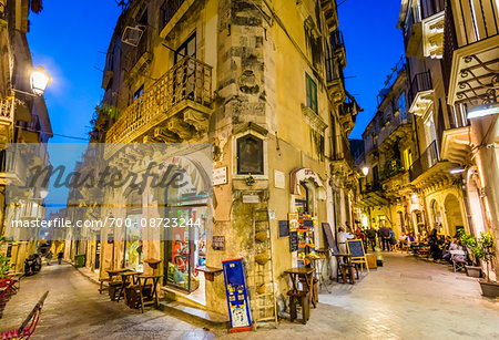 Shops on Via Cavour at Dusk, Ortygia, Syracuse, Sicily, Italy