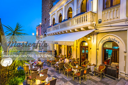 Wunderbar Caffe beside Torre dell'Orolorgio at Dusk in Piazza IX Aprile, Taormina, Sicily, Italy