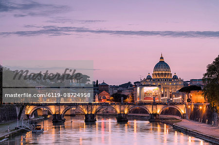 Dusk lights on Tiber River with bridge Umberto I and Basilica di San Pietro in the background, Rome, Lazio, Italy, Europe