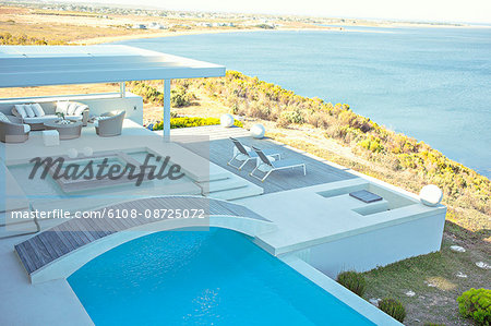 High angle view of swimming pool at resort on seaside