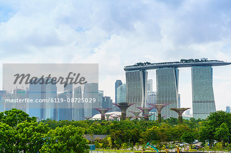 View over the Gardens by the Bay to the three towers of the Marina Bay Sands Hotel and city skyline beyond, Singapore, Southeast Asia, Asia