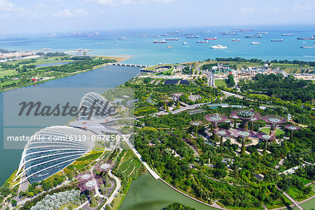 High view overlooking the Gardens by the Bay botanical gardens with its conservatories and Supertree Grove, Singapore, Southeast Asia, Asia