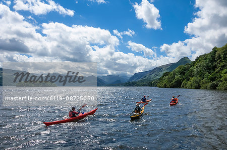 Canoes on Derwentwater, view towards Borrowdale Valley, Keswick, Lake District National Park, Cumbria, England, United Kingdom, Europe