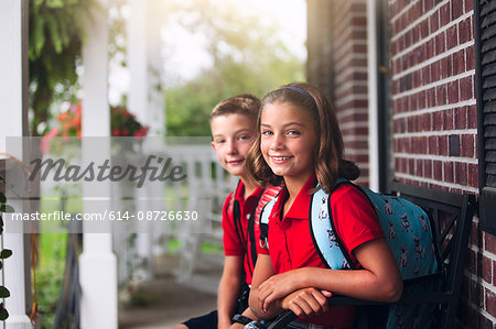 Portrait of twin brother and sister on first day of new school year