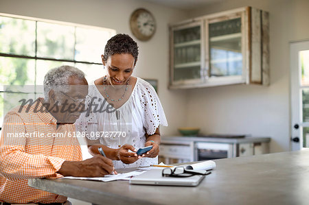 Husband and wife do taxes together.